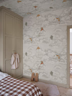 Bonnie & Kites wall mural by Sandberg in cream behind a wavy mirror in a childs room with wooden toys