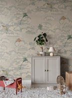 Bonnie & Kites wall mural by Sandberg in blue-grey styled in a childs room with a cabinet and rattan chair