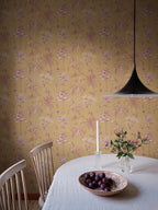Adele wallpaper by Sandberg in Yellow, styled on an interior wall