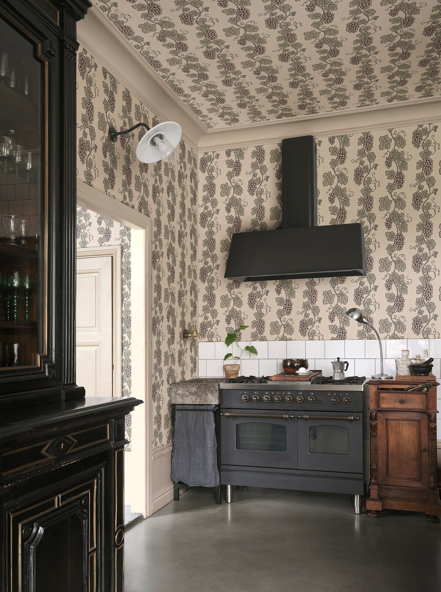 Carla wallpaper by Sandberg in Garden Green, styled on an interior wall