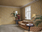 Carla wallpaper by Sandberg in Honey, styled on an interior wall