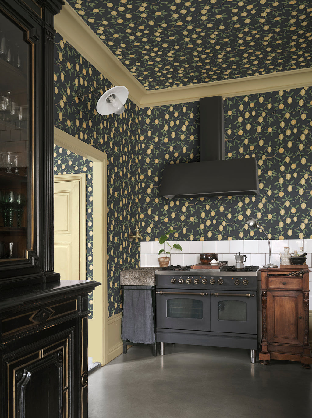 Limone wallpaper by Sandberg in Charcoal, styled on an interior wall