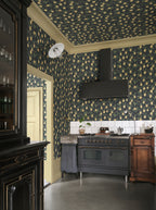 Limone wallpaper by Sandberg in Charcoal, styled on an interior wall