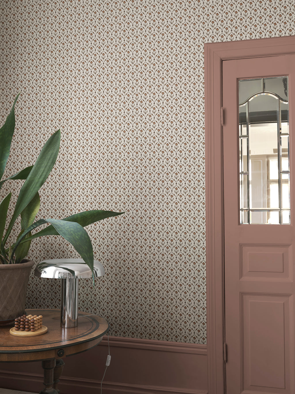 Elena wallpaper by Sandberg in Terracotta, styled on an interior wall