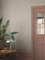Elena wallpaper by Sandberg in Terracotta, styled on an interior wall