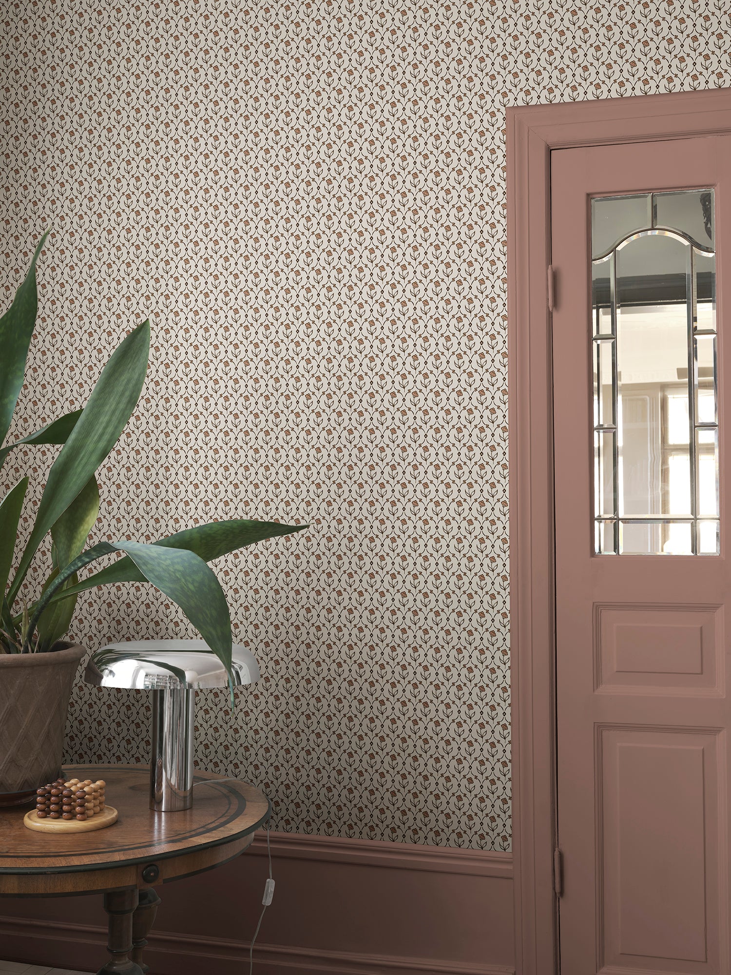 Elena wallpaper by Sandberg in Terracotta, styled on an interior wall