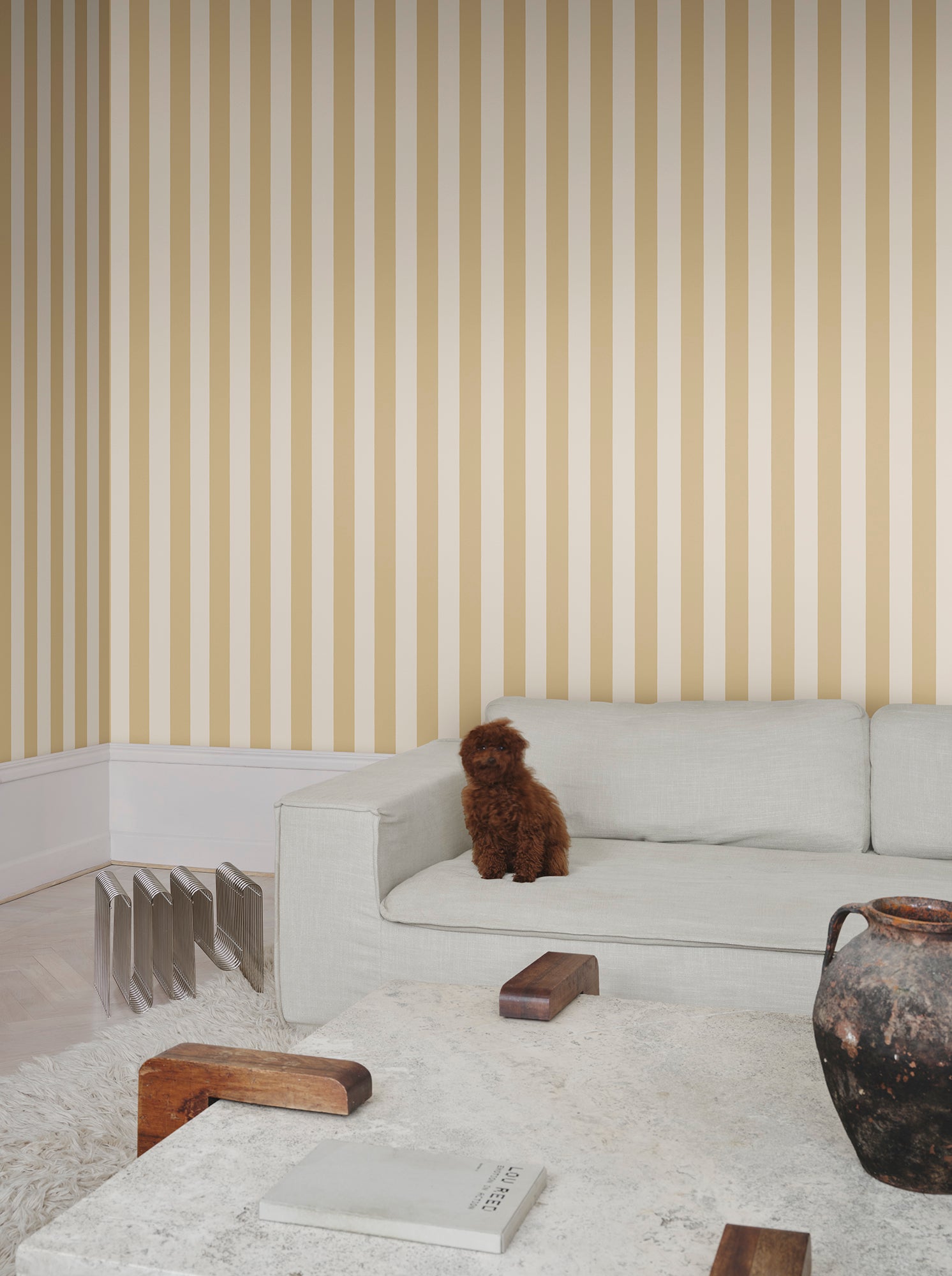 Sam wallpaper by Sandberg in Honey, styled on an interior wall