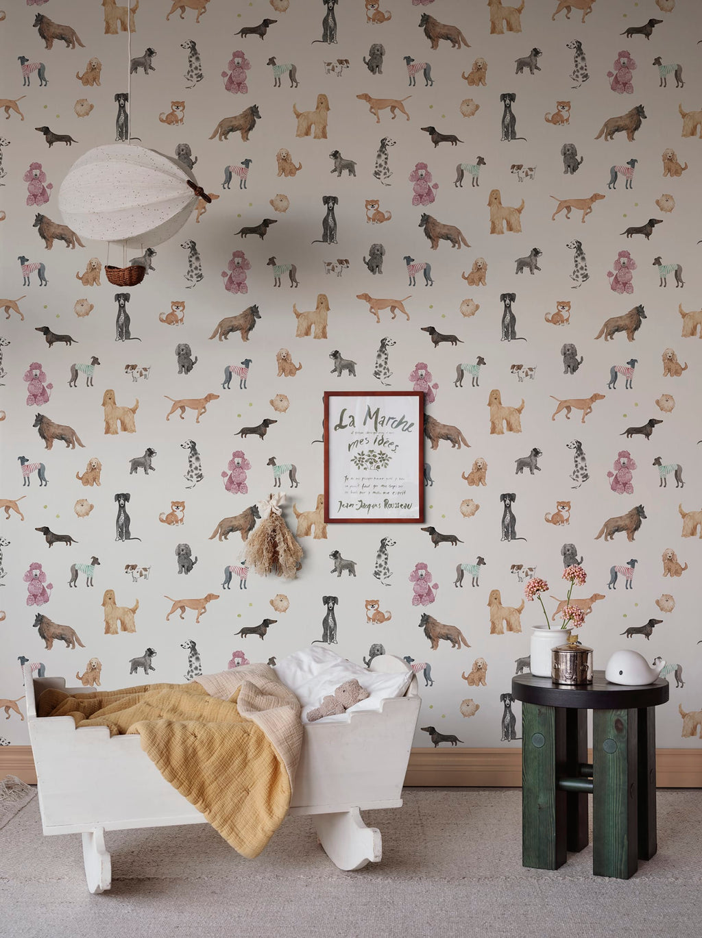 Taiga Dogs & Friends wall mural by Sandberg in white styled in a nursery with a balloon light, cot and side table