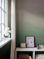 Skymning wall mural by Sandberg, sage green ombré sky styled in a childs room by a window with a moon print and toys