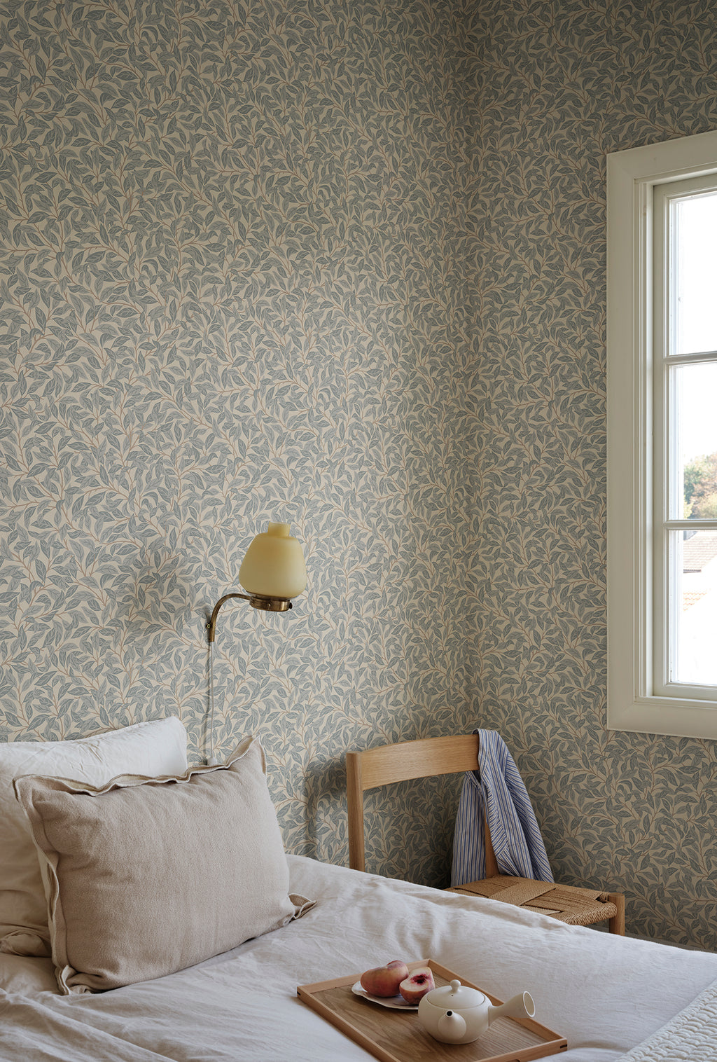 Jonas wallpaper by Sandberg in Misty Blue, styled on an interior wall