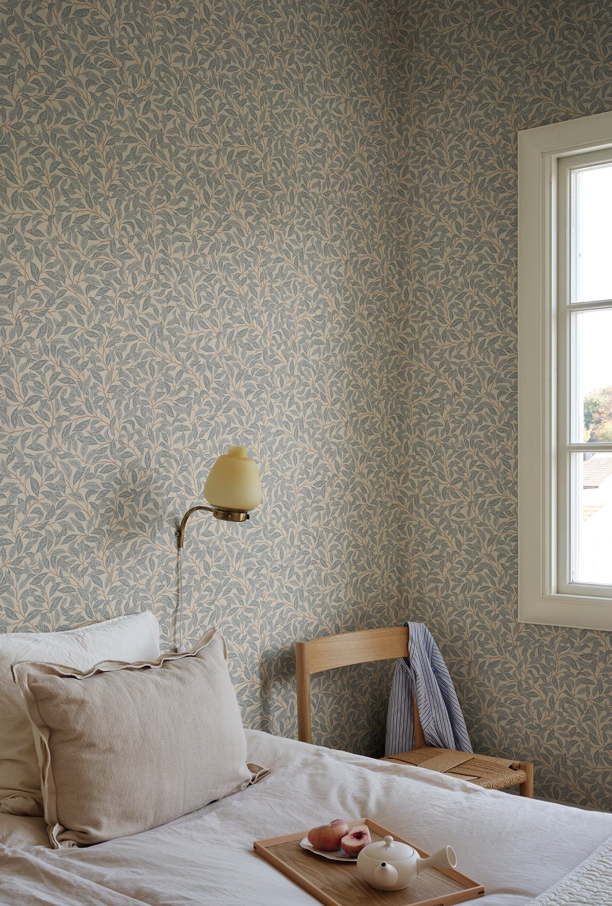 Jonas wallpaper by Sandberg in Misty Blue, styled on an interior wall