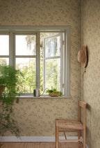 Smilli wallpaper by Sandberg in Clay, styled on an interior wall