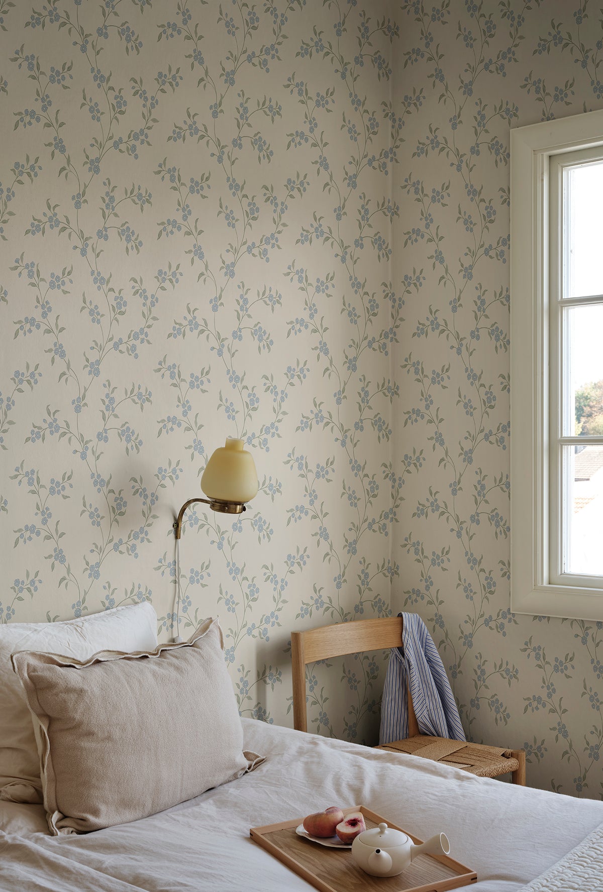 Smilli wallpaper by Sandberg in Misty Blue, styled in a room, view 2