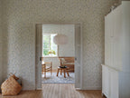Lucy wallpaper by Sandberg in Sky Blue, styled on an interior wall