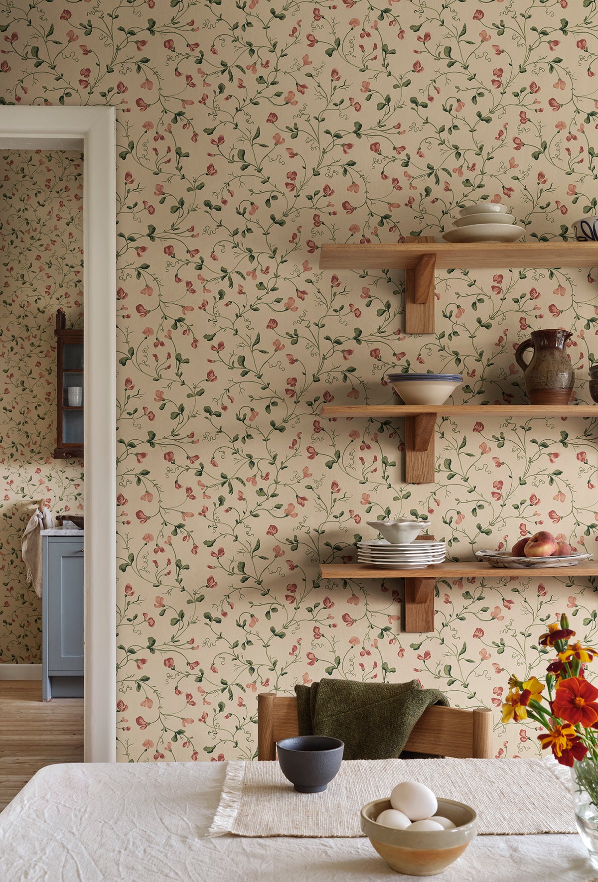 Lucy wallpaper by Sandberg in Oat, styled on an interior wall