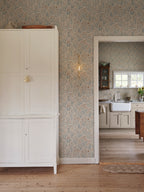 Märta wallpaper by Sandberg in Misty Blue, styled on an interior wall