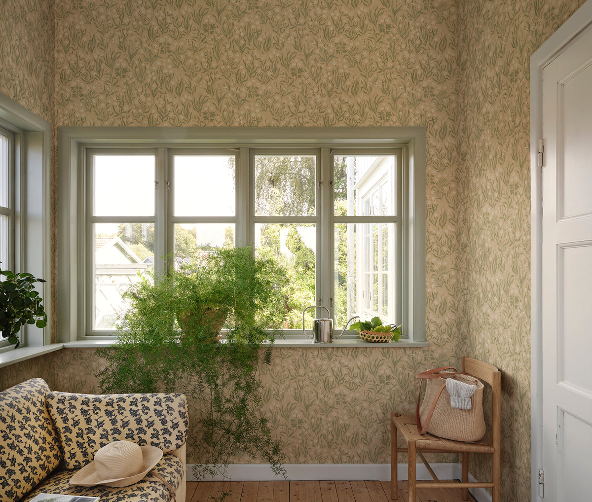 Märta wallpaper by Sandberg in Beige, styled on an interior wall