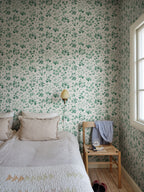 Bellis wallpaper by Sandberg in Emerald, styled on an interior wall
