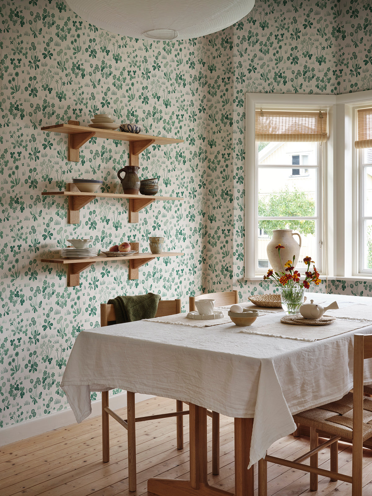 Bellis wallpaper by Sandberg in Emerald, styled in a room, view 2