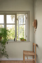 Fabian wallpaper by Sandberg in Garden Green, styled on an interior wall