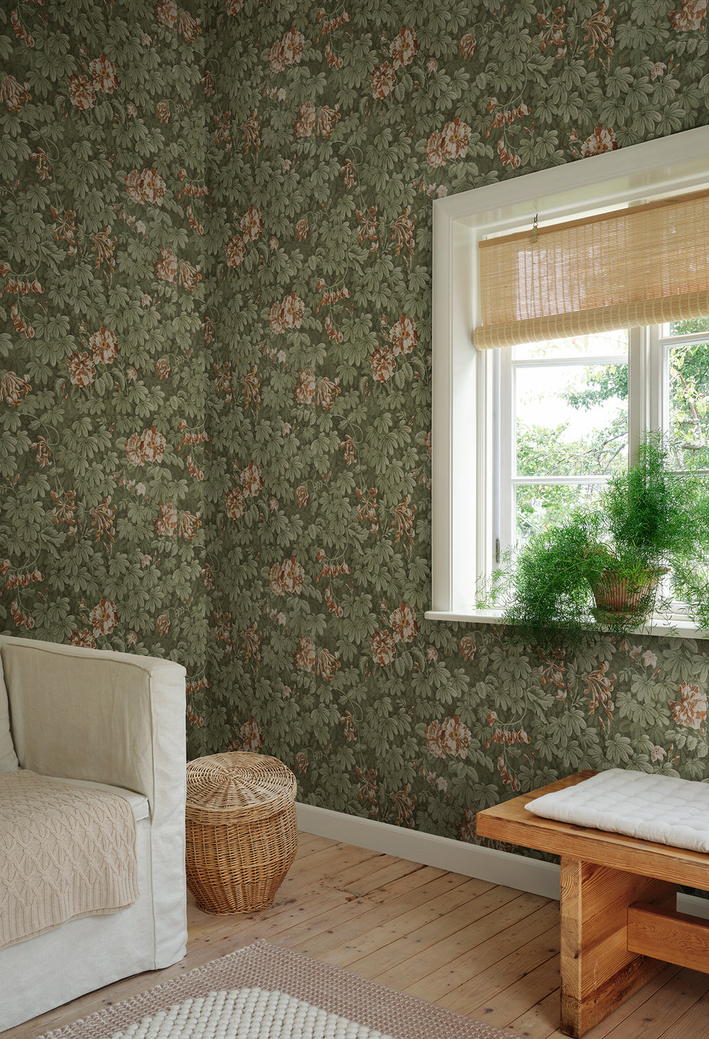 Tyra wallpaper by Sandberg in Forest Green, styled on an interior wall