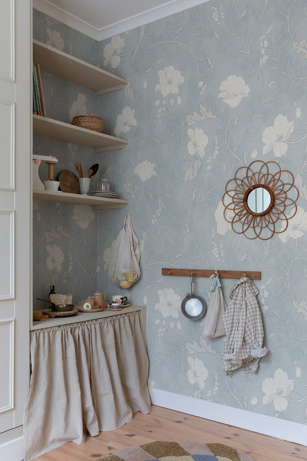Poppy wallpaper by Sandberg in Light Blue, styled on an interior wall