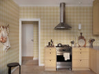 Lykke wallpaper by Sandberg in Yellow, styled on an interior wall
