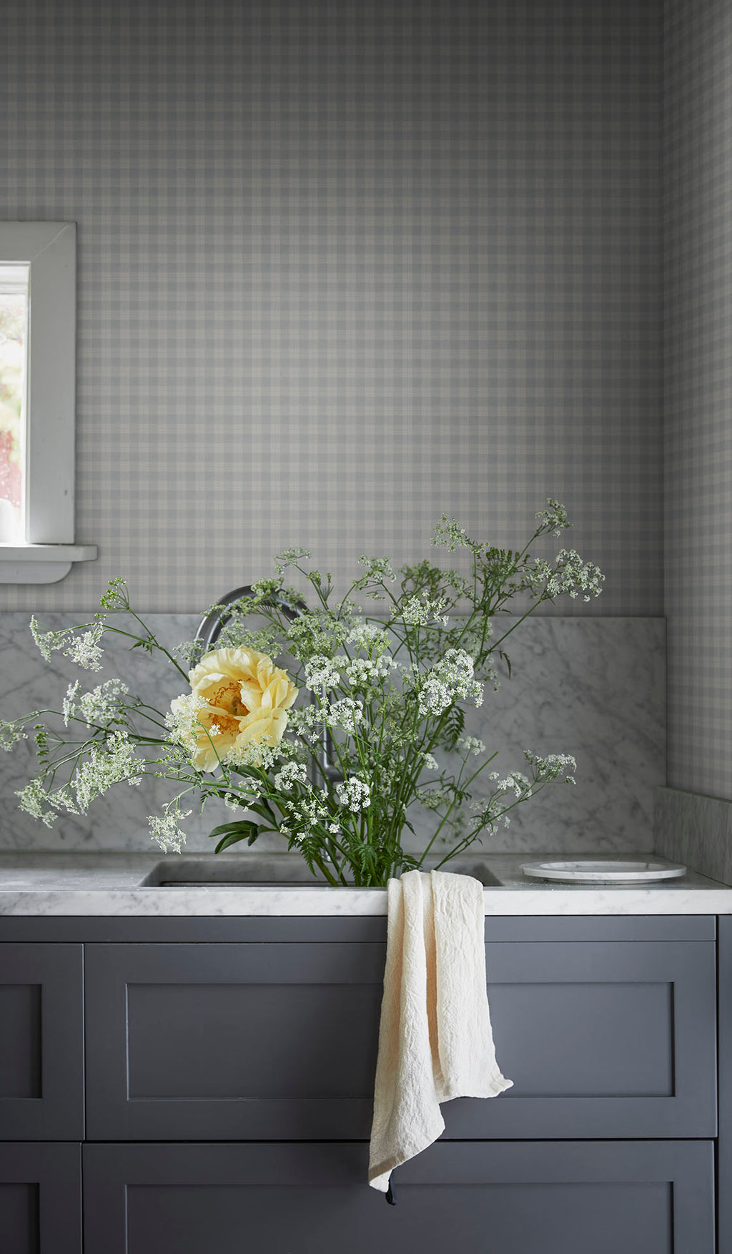 Herman wallpaper by Sandberg in Misty Blue, styled on an interior wall