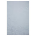 Sea Scape wallpaper by Abigail Edwards in Moonlight behind a grey bed, soft blue-grey wave-line print