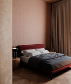 Lana wallpaper by Arte in Pink in a bedroom with a red bed