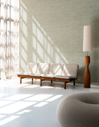 Matiz wallpaper by Arte in Beige – Elephant in a bright room with a sofa and a tall floor lamp