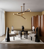 Ovillo wallpaper by Arte in Gold in a dining room with a modern chandelier