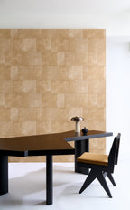 Cuadro wallpaper by Arte in Beige – Cloth behind a black desk and a timber chair