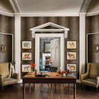 Mimi Leopard wallpaper by Romo in Tan - animals design, leopard spots in a study with framed prints and a writing desk