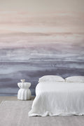 Sediment wall mural by Emma Hayes in Sunset, blush-pink fading to dusky blue-grey watercolour bands styled behind a