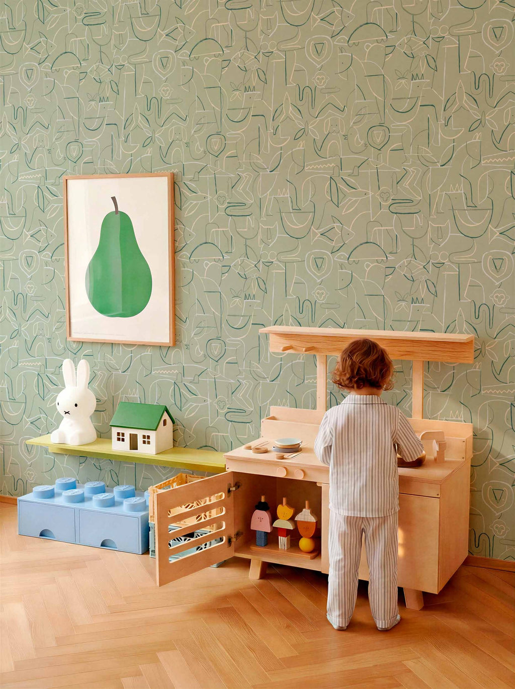 Animalia wallpaper by Coordonné in Green – Emerald, styled room