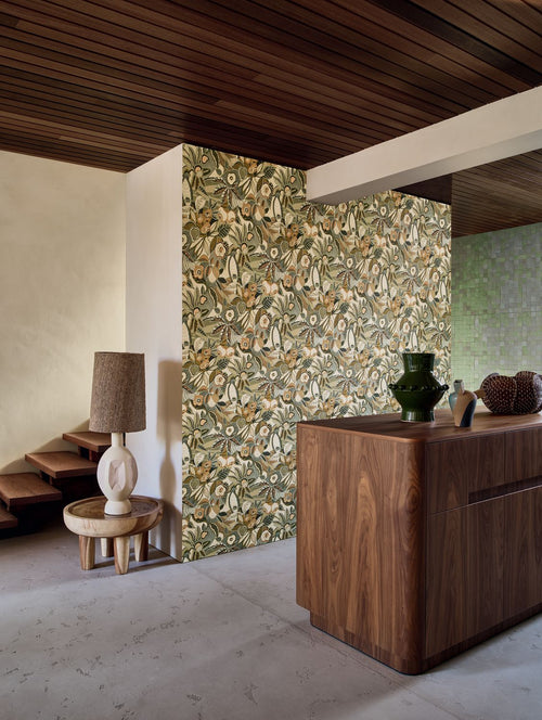 Tehuana wallpaper by Casamance in celadon and almond, a botanical floral print styled on a partition wall beneath a slatted
