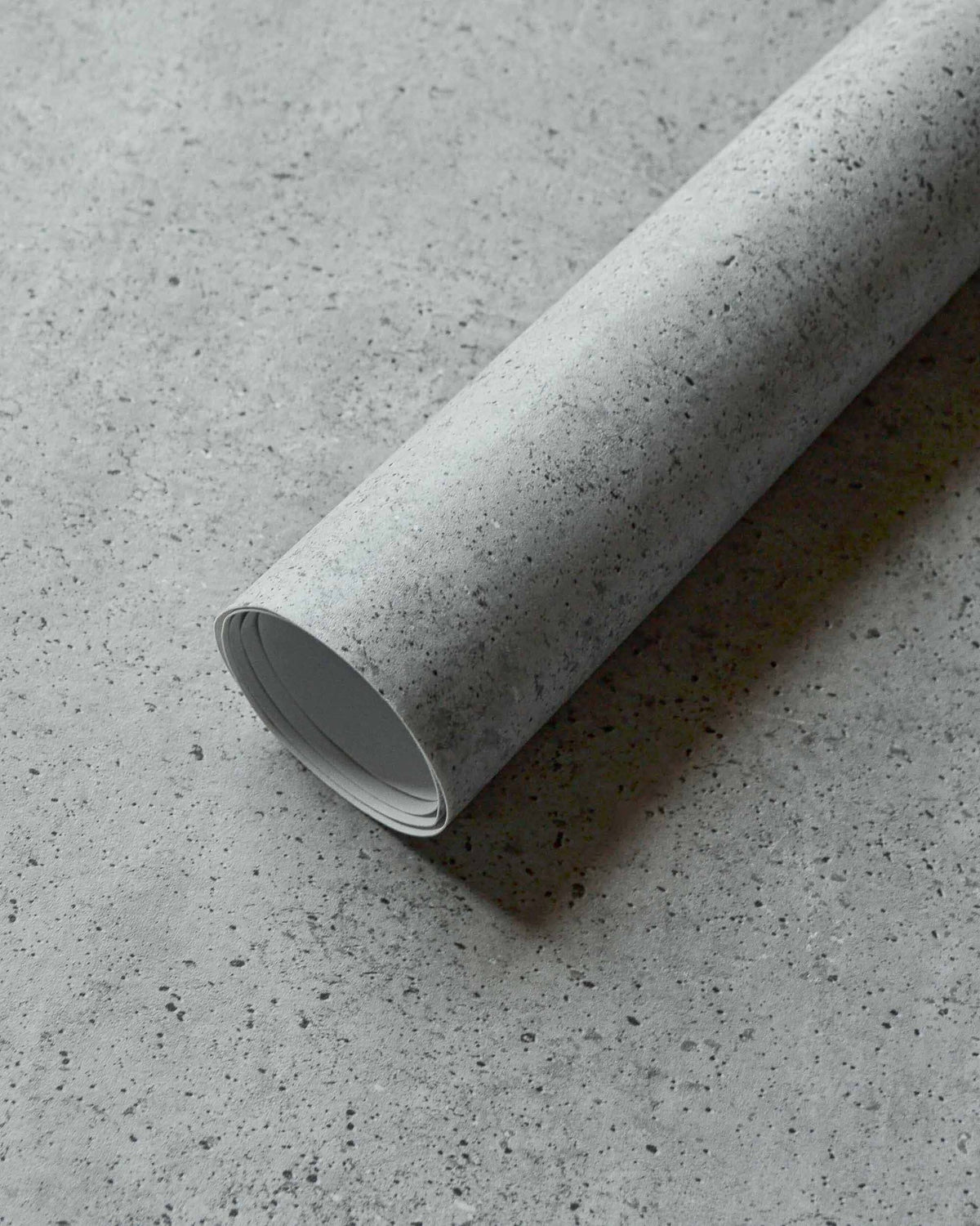 Ciment wallpaper by Coordonné in Grey – Steel, roll close-up