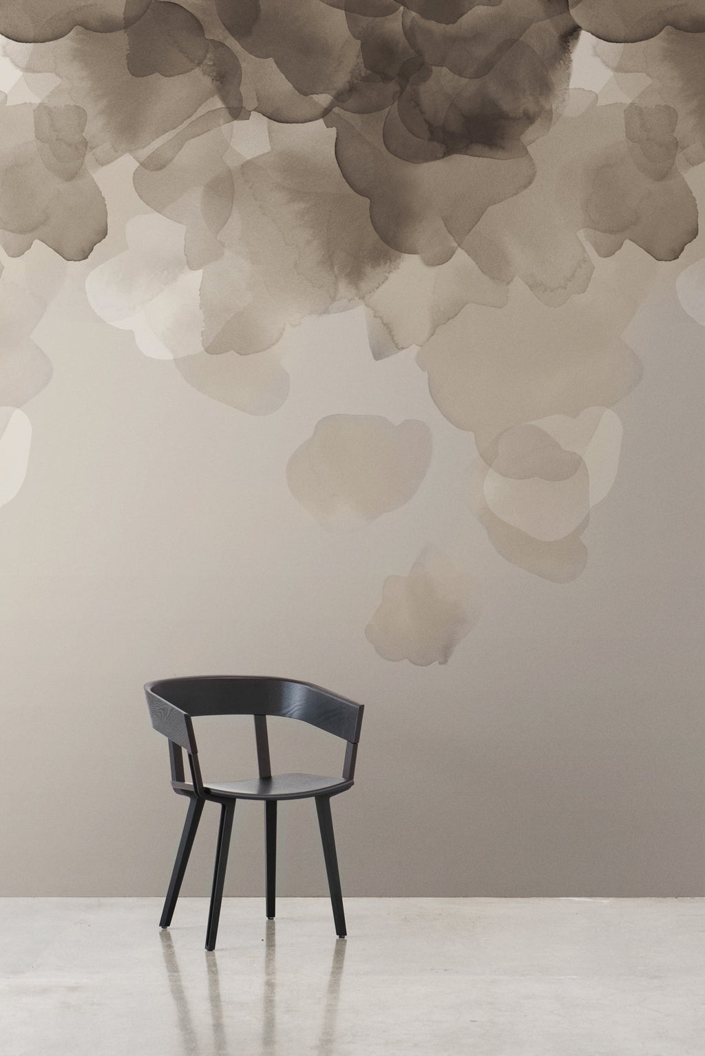 Bloom wallpaper by Emma Hayes in silver, taupe watercolour petals cascading behind a black chair