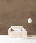 Dispersion wall mural by Emma Hayes in Earth, warm chocolate-brown watercolour washes in a neutral lounge