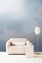 Dispersion wall mural by Emma Hayes in Sky Metallic, powder-blue watercolour clouds with a soft silvery shimmer