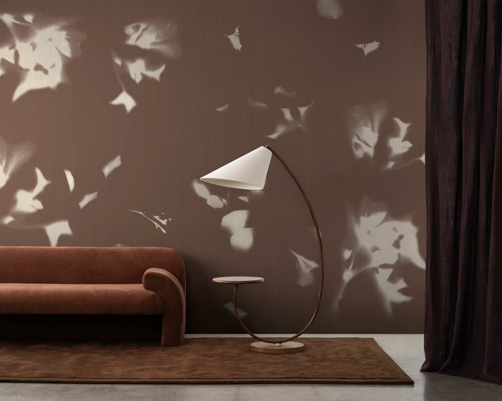 Drift wallpaper by Emma Hayes in Umber styled in a warm contemporary living room — hero lifestyle shot