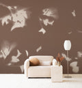Drift wall mural by Emma Hayes in Umber, cream foliage shadows on a warm earthy brown wall