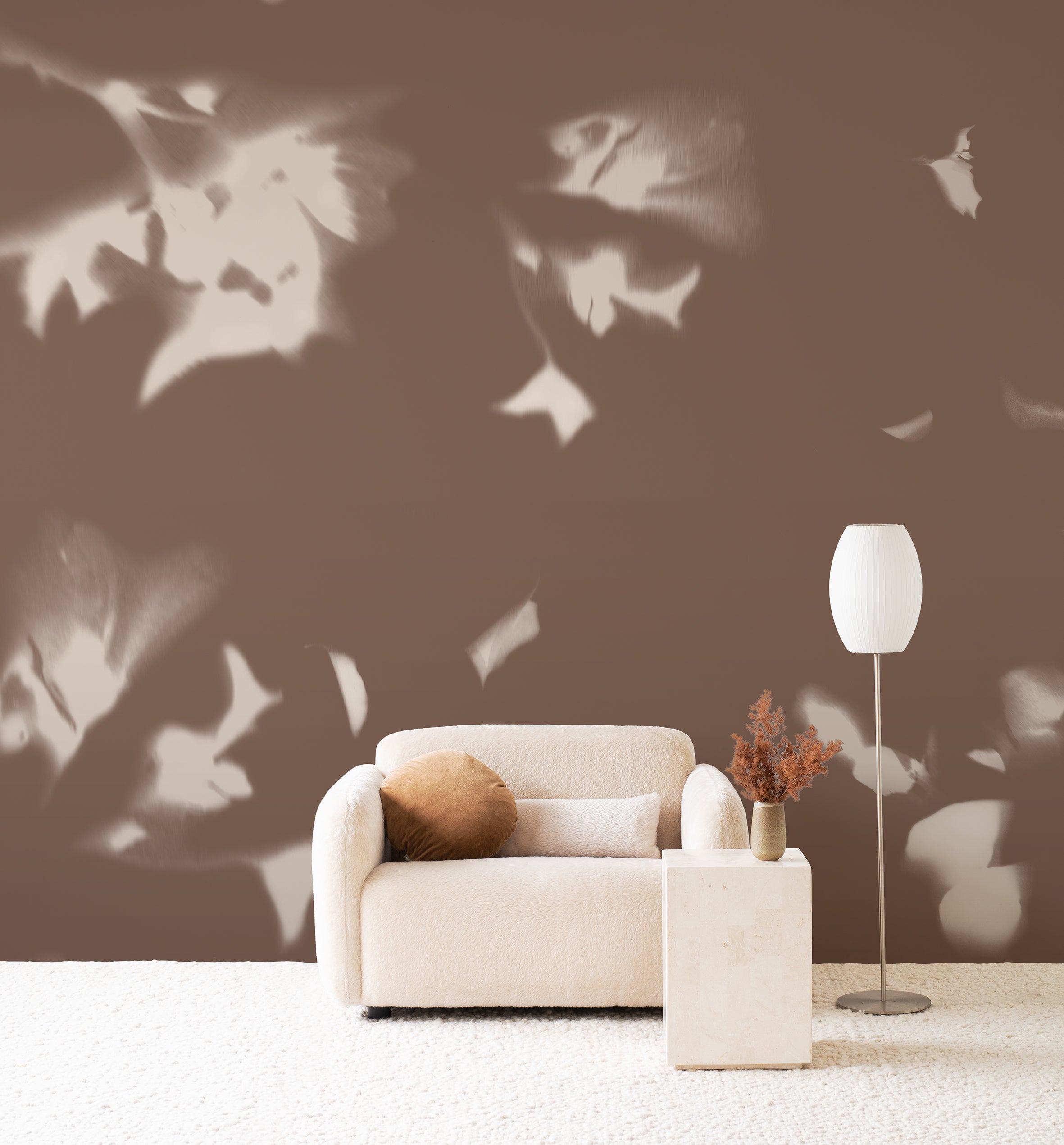 Drift wall mural by Emma Hayes in Umber, cream foliage shadows on a warm earthy brown wall