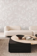 Palm wallpaper by Emma Hayes in whisper, tonal white and grey palm fronds, styled behind a cream sofa in a neutral living room