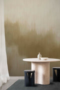 Solar wall mural by Emma Hayes in Gold Metallic, warm olive-gold haze with a lustrous metallic sheen styled behind a stone