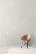 Vine wall mural by Emma Hayes in Oatmeal, soft tonal grey line-drawn leaves on greige, styled with a timber bowl chair
