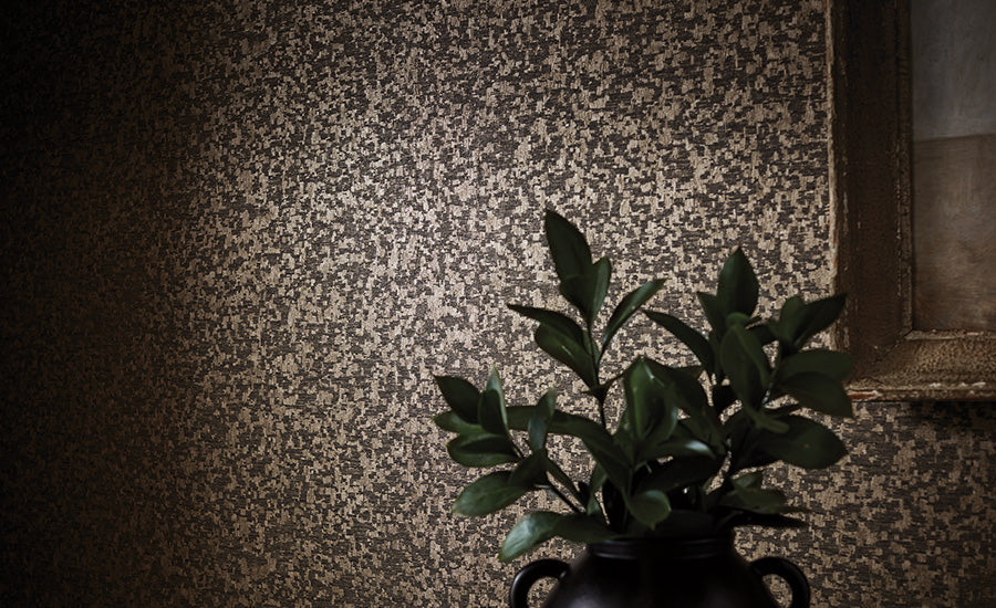 Dufrene wallpaper by Romo, a mottled distressed plaster effect in greige, styled with a gilt frame and dark foliage