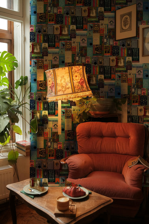 Harry Potter Hogwarts Library Bookshelf wallpaper mural on the wall of a reading nook with a pink velvet armchair