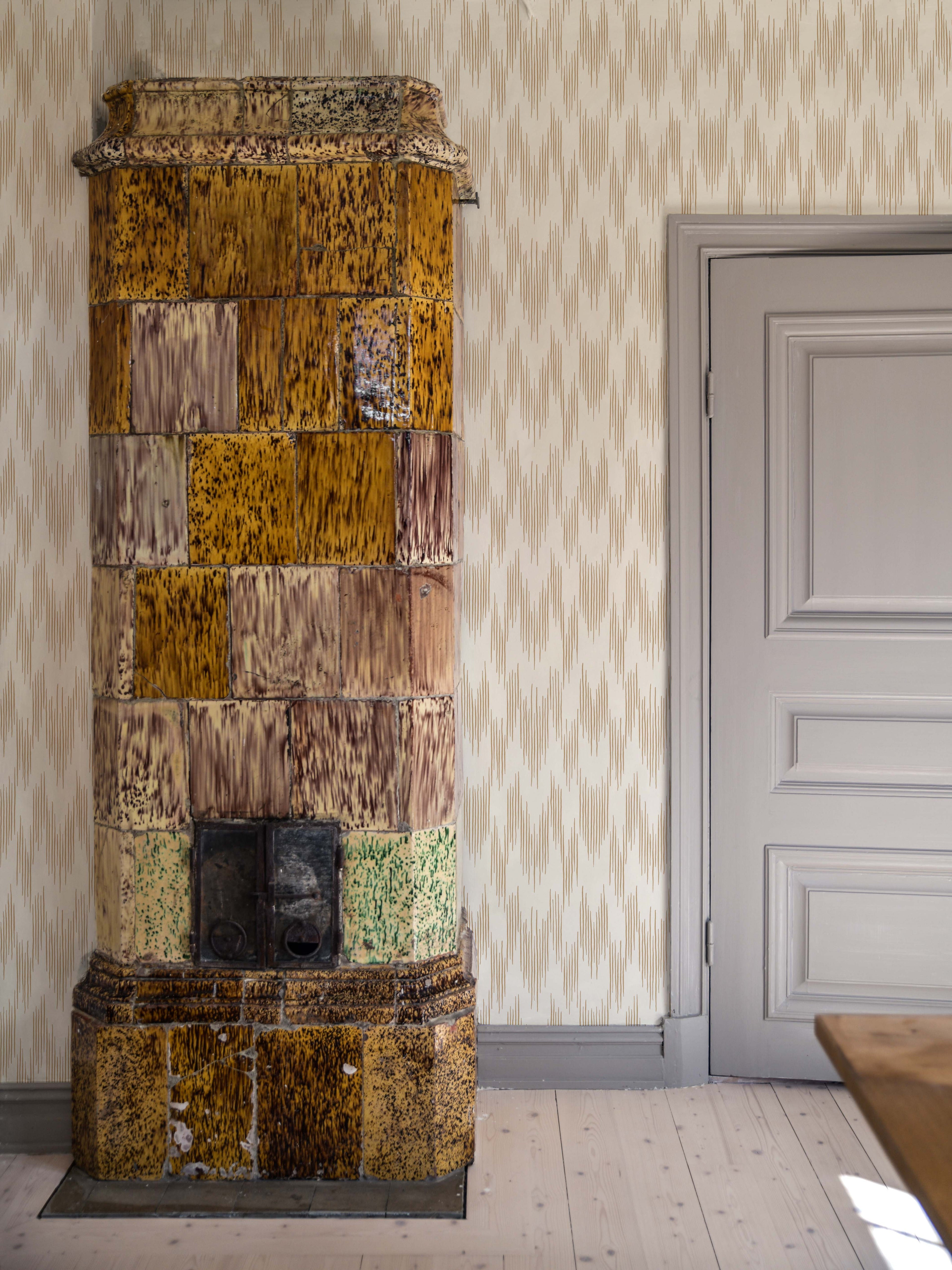 Ikat wallpaper by Langelid/von Bromssen - geometric design in Brown